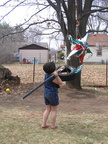 Kayla attacks the pinata.